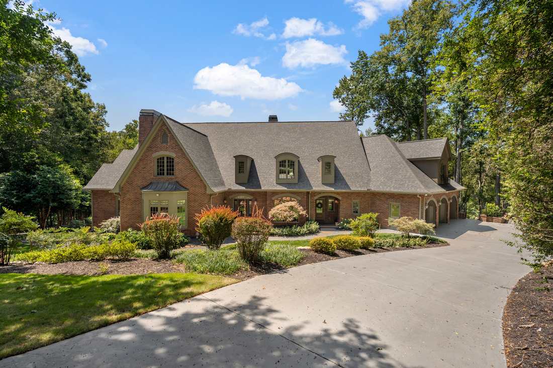 Brick, stucco and steep dormers